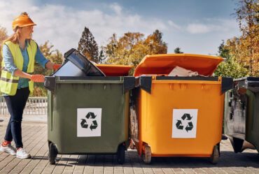 junk removal services at house worker loading bins