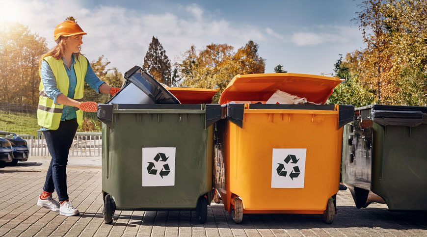 junk removal services at house worker loading bins